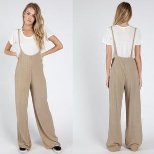 WILD HONEY TIE JUMPSUIT in black. Size M